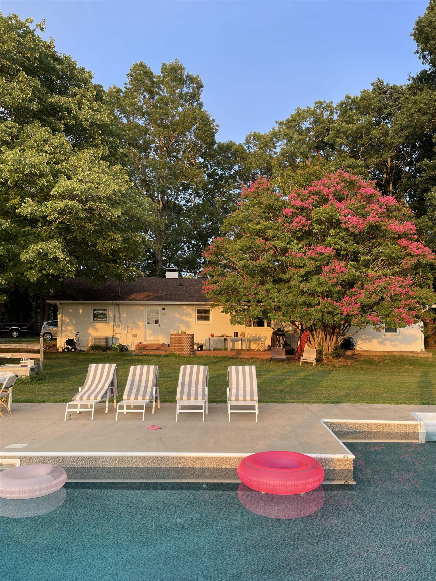 10611 Rougemont Road Bahama, NC 27503 - Photo 2 of 66 a view of a swimming pool with an outdoor seating and a yard