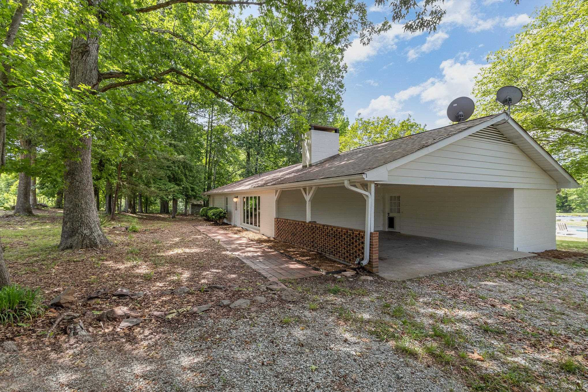 10611 Rougemont Road Bahama, NC 27503 - Photo 59 of 66 a view of a house with a yard and garage