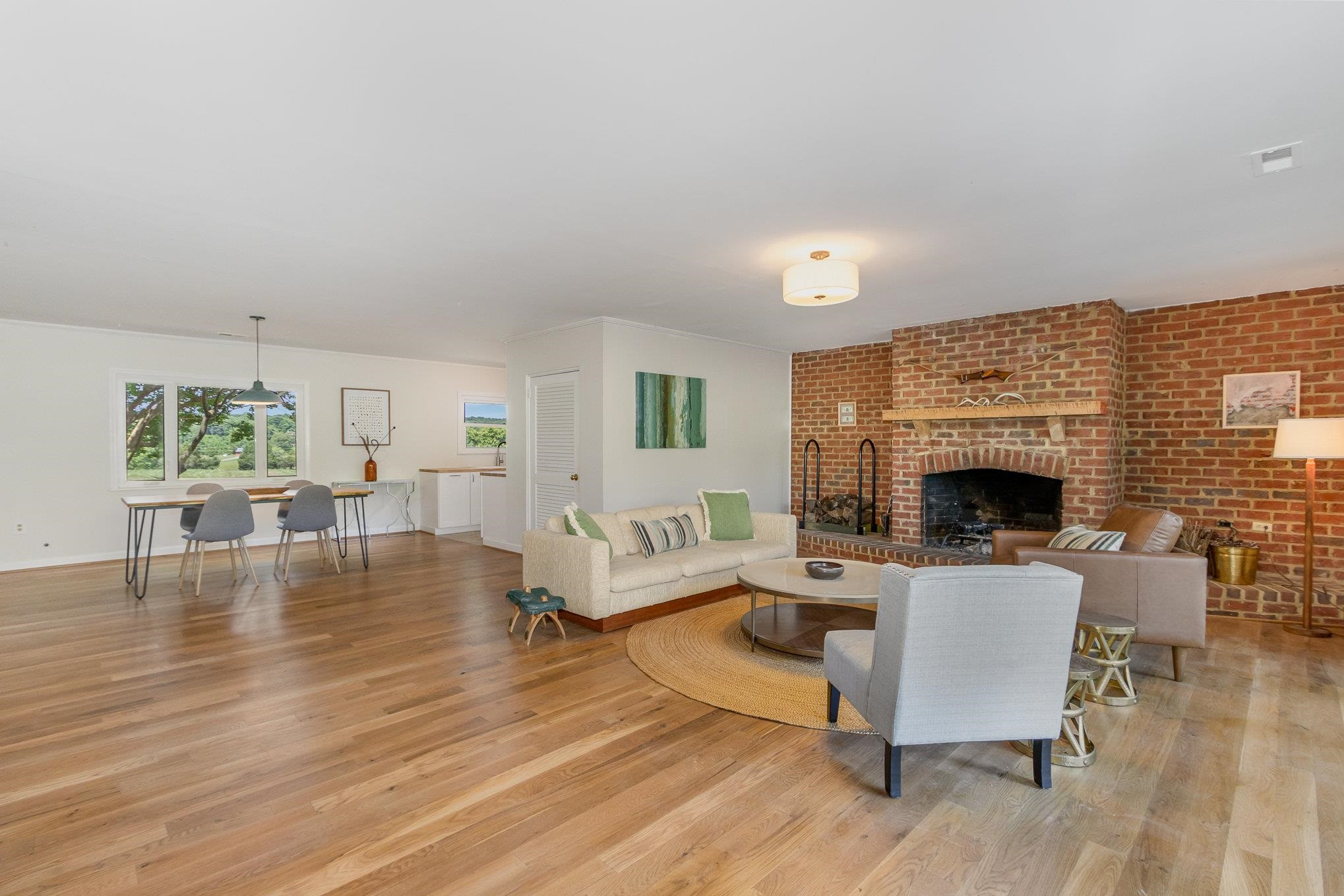 10611 Rougemont Road Bahama, NC 27503 - Photo 6 of 66 a living room with furniture and a fireplace
