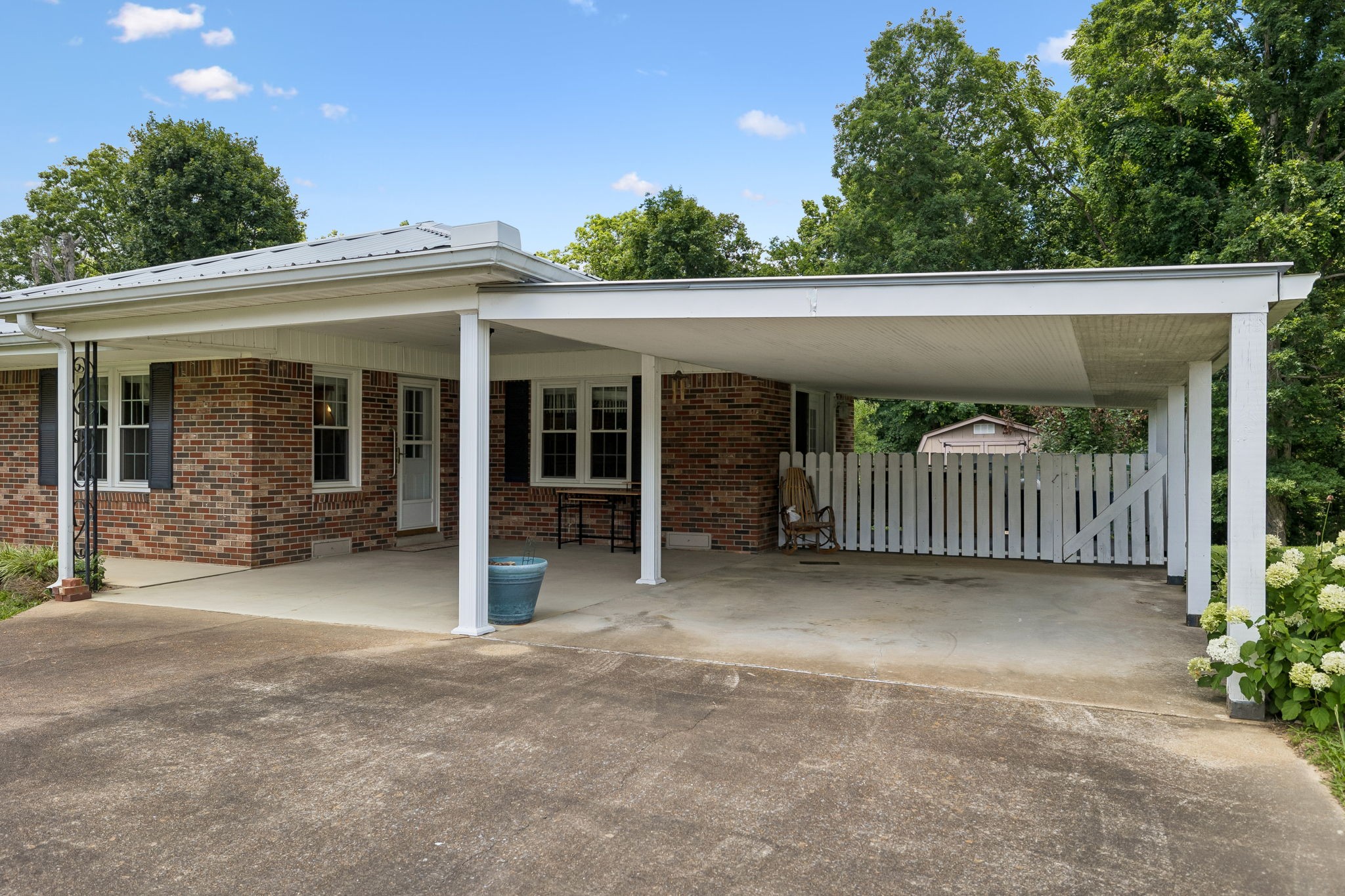 708 Hickory Street Centerville, TN 37033 - Photo 7 of 57 a view of a porch with furniture and garden