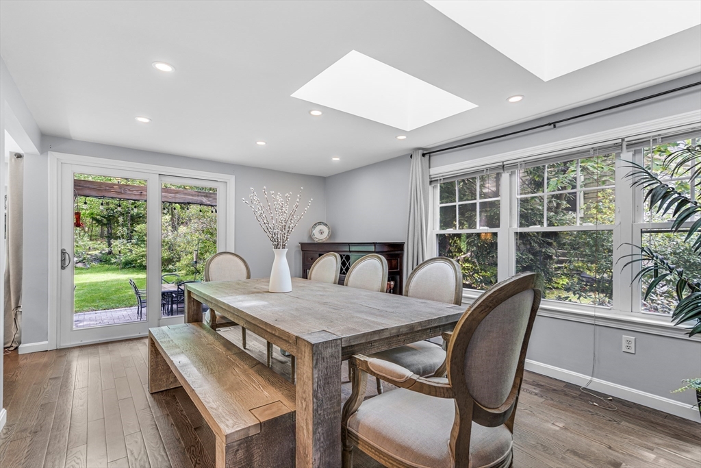 121 Shade Street Lexington, MA 02421 - Photo 13 of 42 a view of a dining room with furniture window and wooden floor
