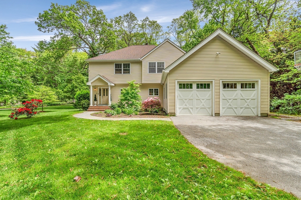 121 Shade Street Lexington, MA 02421 - Photo 2 of 42 a front view of a house with garden