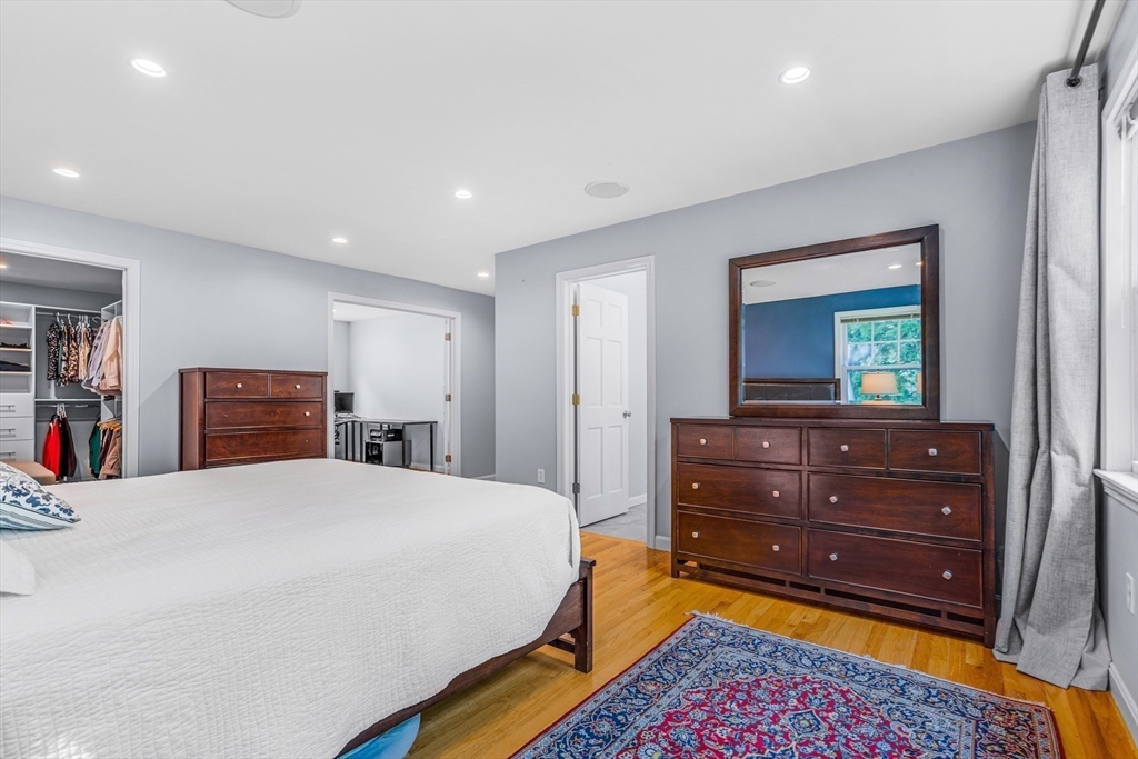 121 Shade Street Lexington, MA 02421 - Photo 22 of 42 a bed room with a bed and a television