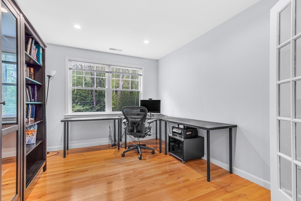 121 Shade Street Lexington, MA 02421 - Photo 23 of 42 a view of a workspace with furniture and a window