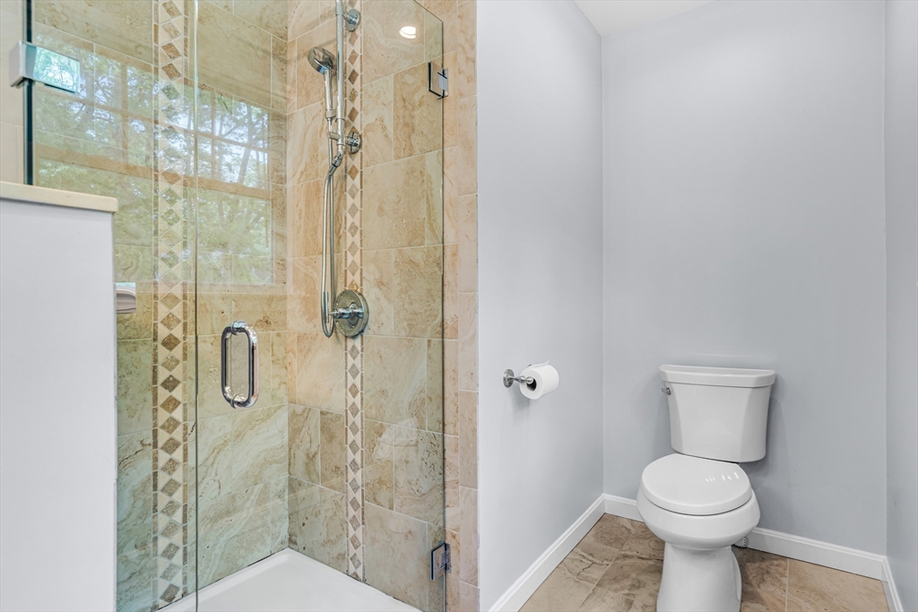 121 Shade Street Lexington, MA 02421 - Photo 26 of 42 a bathroom with a toilet and a shower