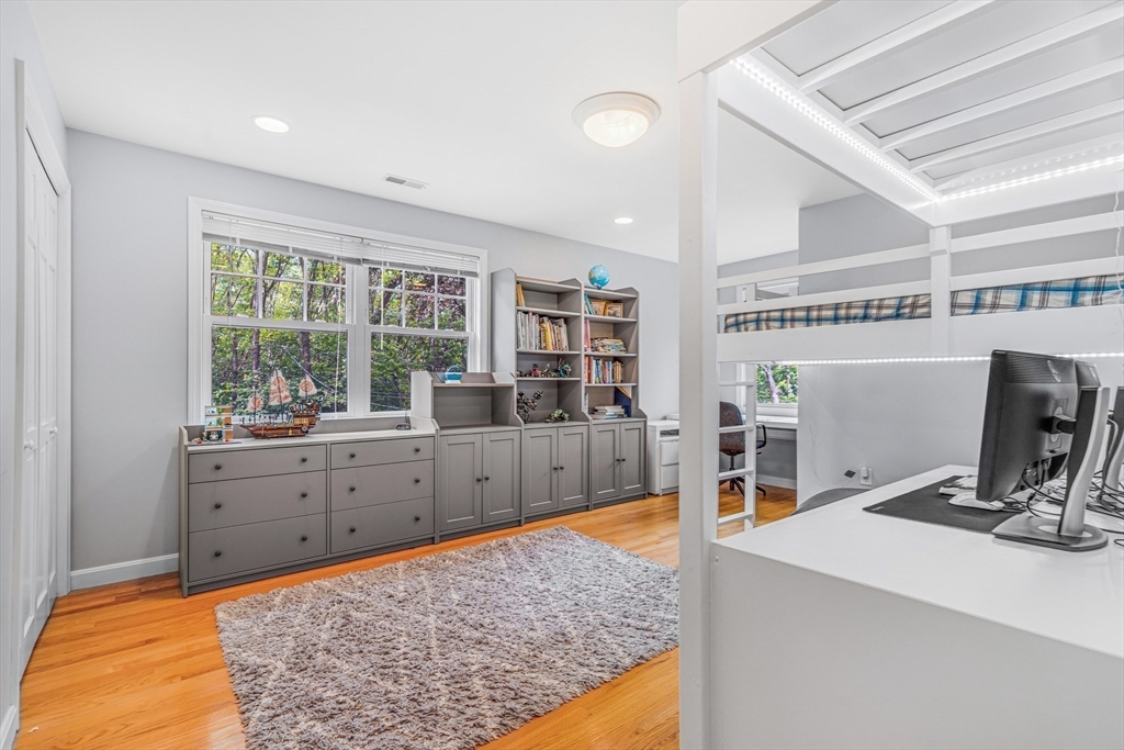 121 Shade Street Lexington, MA 02421 - Photo 29 of 42 a kitchen with stainless steel appliances kitchen island granite countertop a sink and cabinets