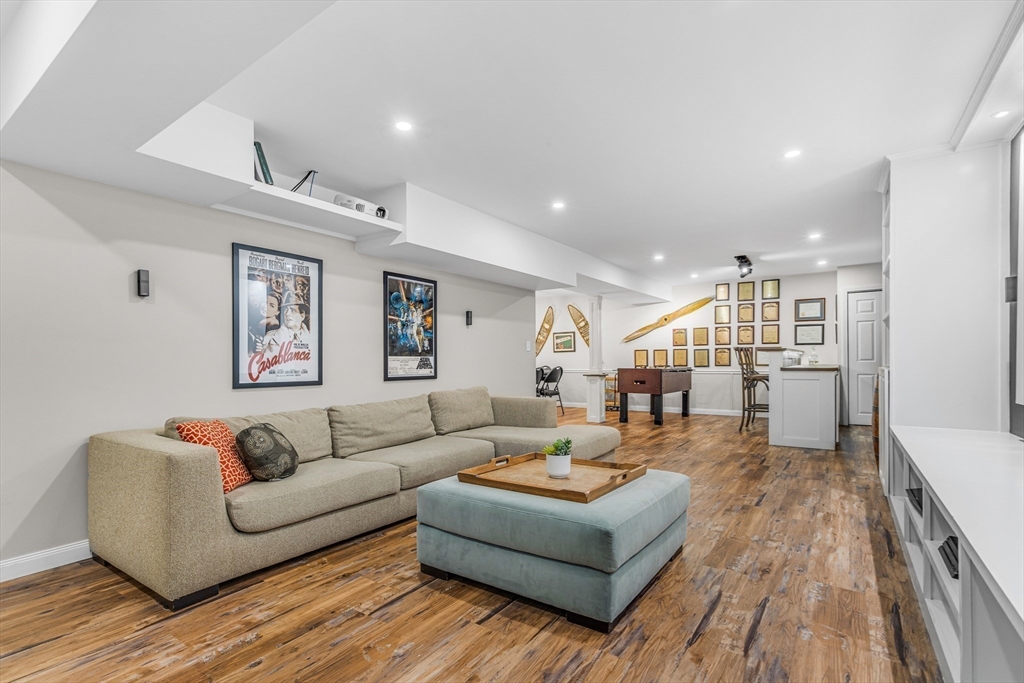 121 Shade Street Lexington, MA 02421 - Photo 32 of 42 a living room with furniture and wooden floor