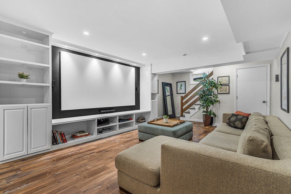 121 Shade Street Lexington, MA 02421 - Photo 33 of 42 a living room with furniture and a flat screen tv