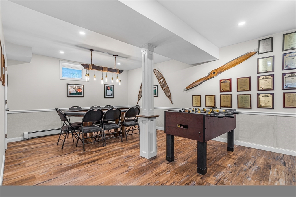 121 Shade Street Lexington, MA 02421 - Photo 34 of 42 a living room with lots of furniture and a wooden floor