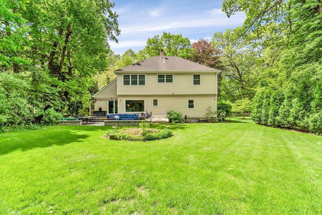 121 Shade Street Lexington, MA 02421 - Photo 37 of 42 a front view of a house with yard and green space