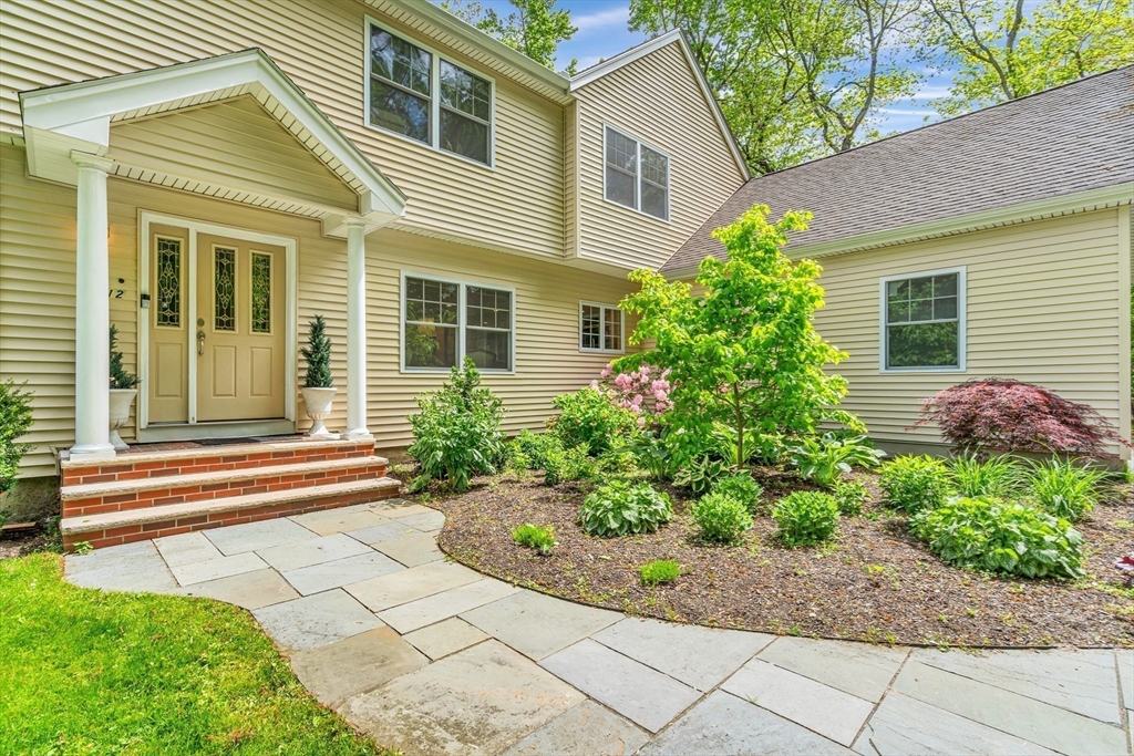 121 Shade Street Lexington, MA 02421 - Photo 4 of 42 a front view of a house with garden
