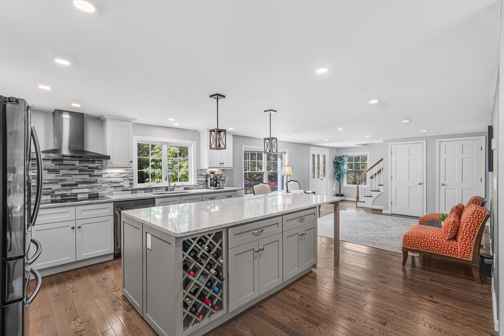 121 Shade Street Lexington, MA 02421 - Photo 6 of 42 a kitchen with stainless steel appliances granite countertop a sink and stove top oven