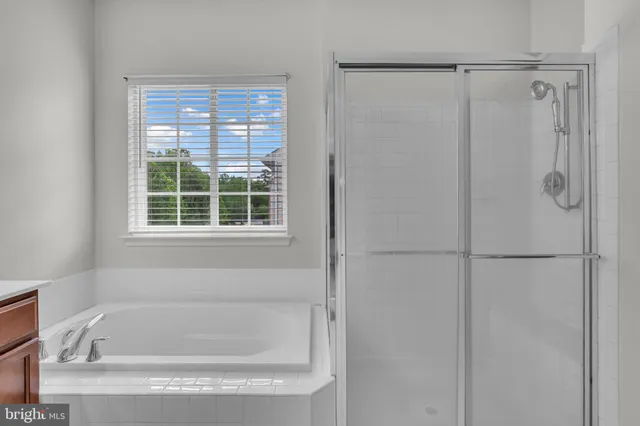 a white bath tub sitting next to a window