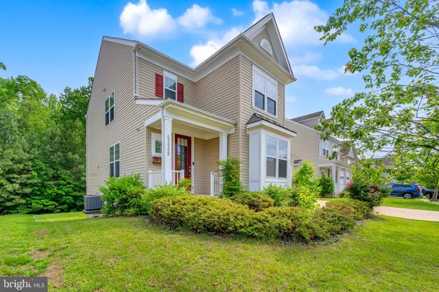 front view of a house with a garden