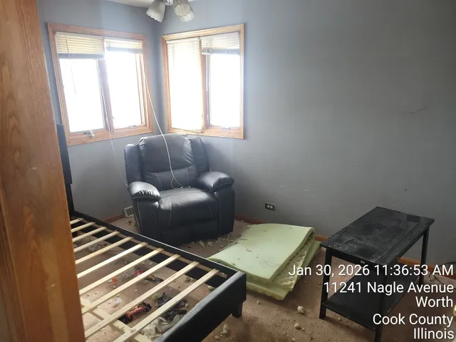 a living room with furniture and a window