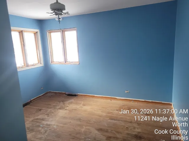 an empty room with windows