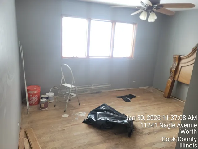 a bedroom with a bed and a mirror