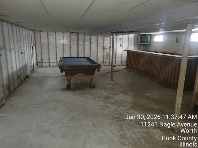 a living room with a furniture and a rug