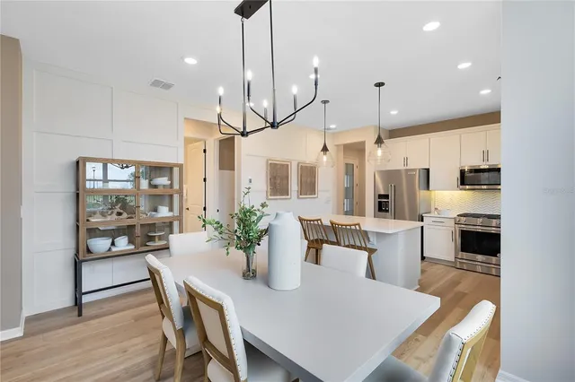 a kitchen with a table and chairs