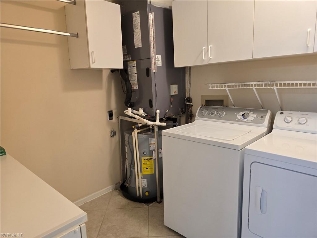 5741 Whitaker Road, Unit D203 Naples, FL 34112 - Photo 20 of 30 a utility room with dryer and washer