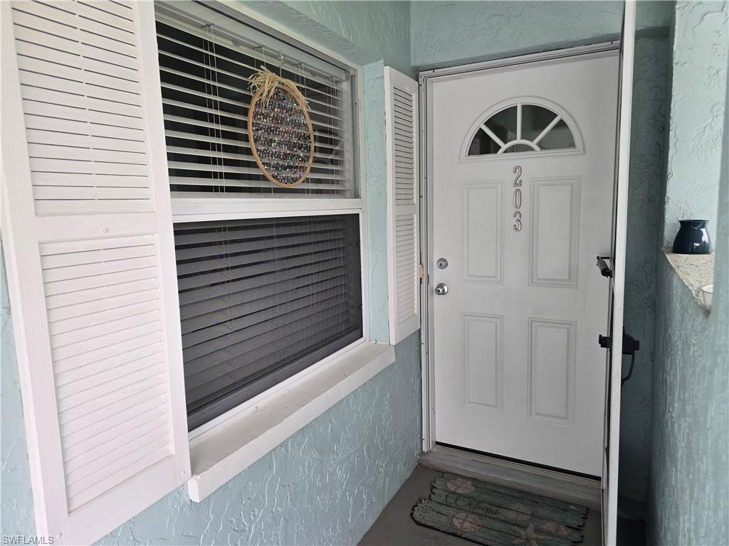 5741 Whitaker Road, Unit D203 Naples, FL 34112 - Photo 2 of 21 Entrance to 4751 Whitaker Road 203