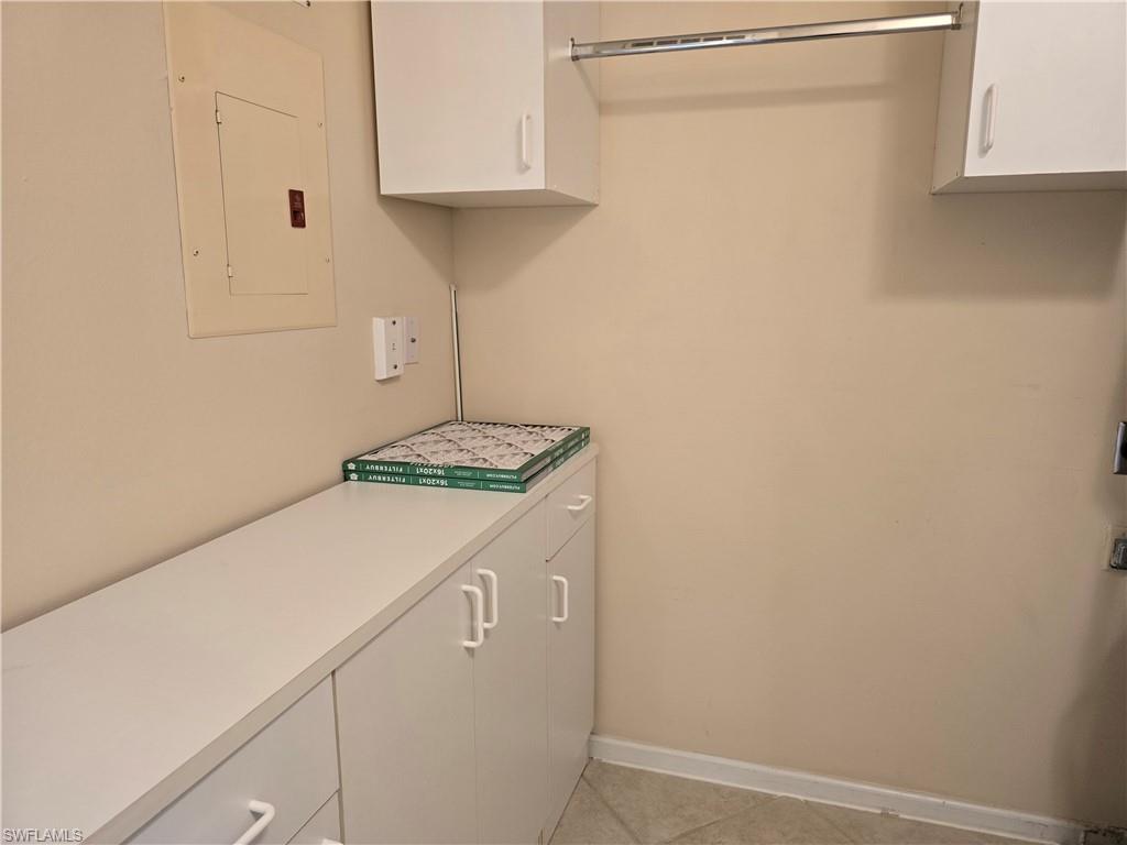 5741 Whitaker Road, Unit D203 Naples, FL 34112 - Photo 21 of 30 a room with storage and utility