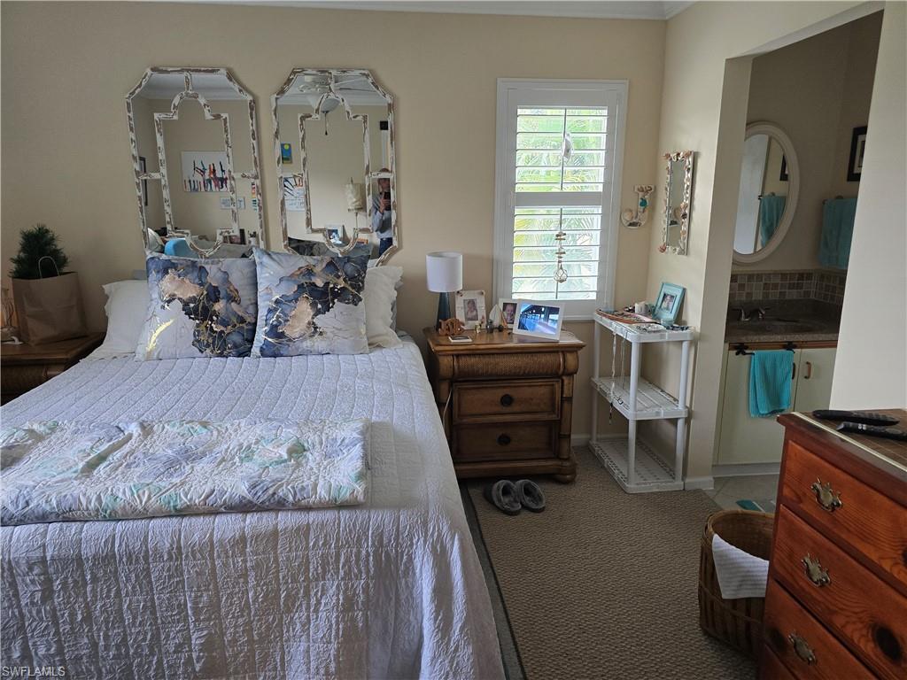 5741 Whitaker Road, Unit D203 Naples, FL 34112 - Photo 10 of 21 3rd Bedroom featuring carpet flooring and baseboards. Unit is being rented unfurnished