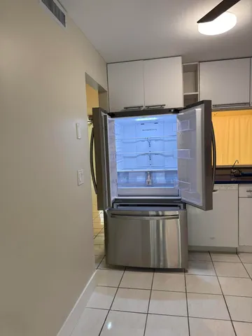 a stove top oven sitting inside of a kitchen