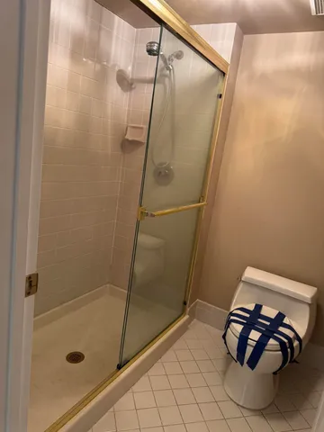 a bathroom with a glass shower door