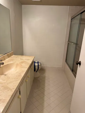a bathroom with a sink and a granite countertop