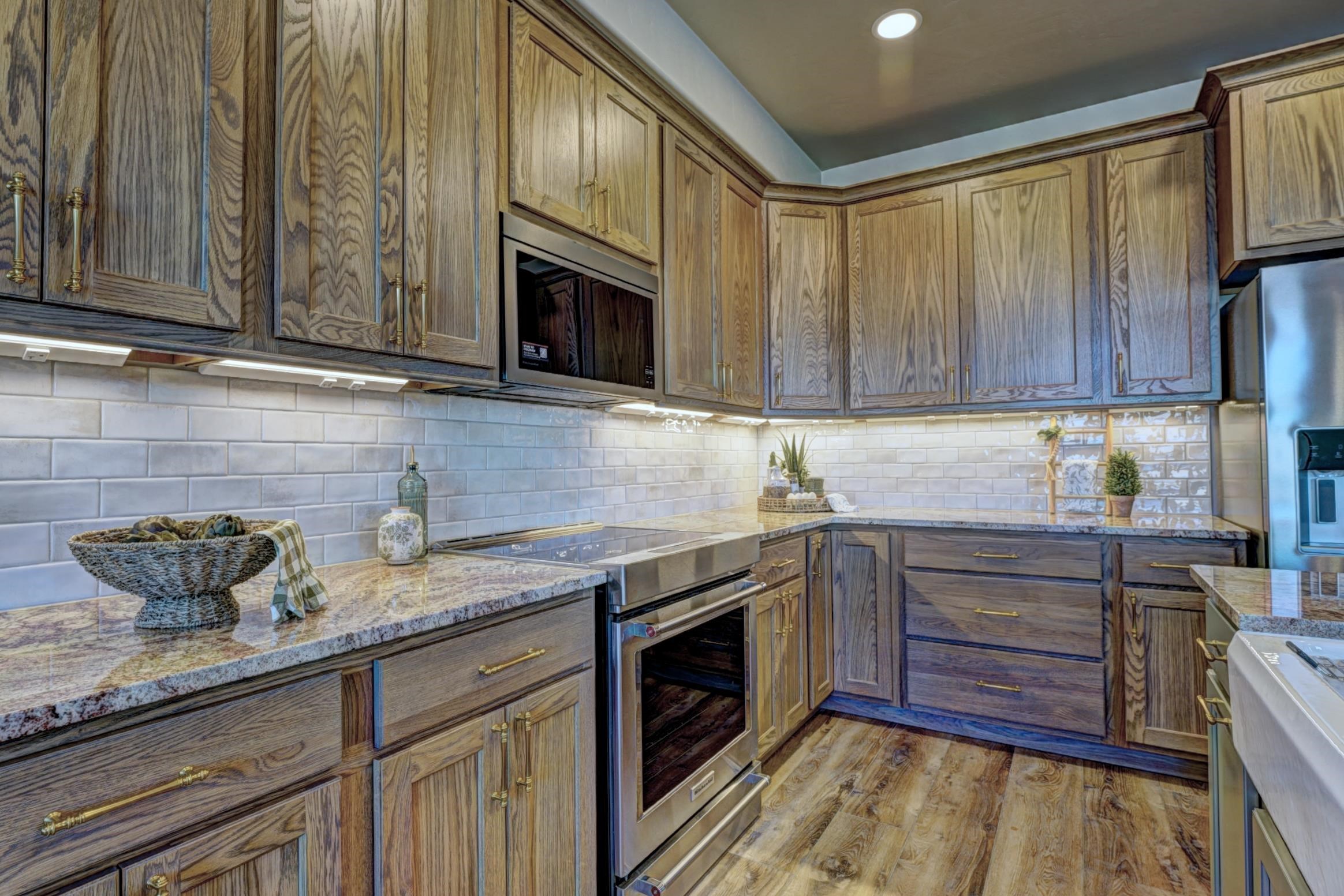 1985 Tomochic Drive Fruita, CO 81521 - Photo 15 of 42 a kitchen with granite countertop cabinets and steel stainless steel appliances
