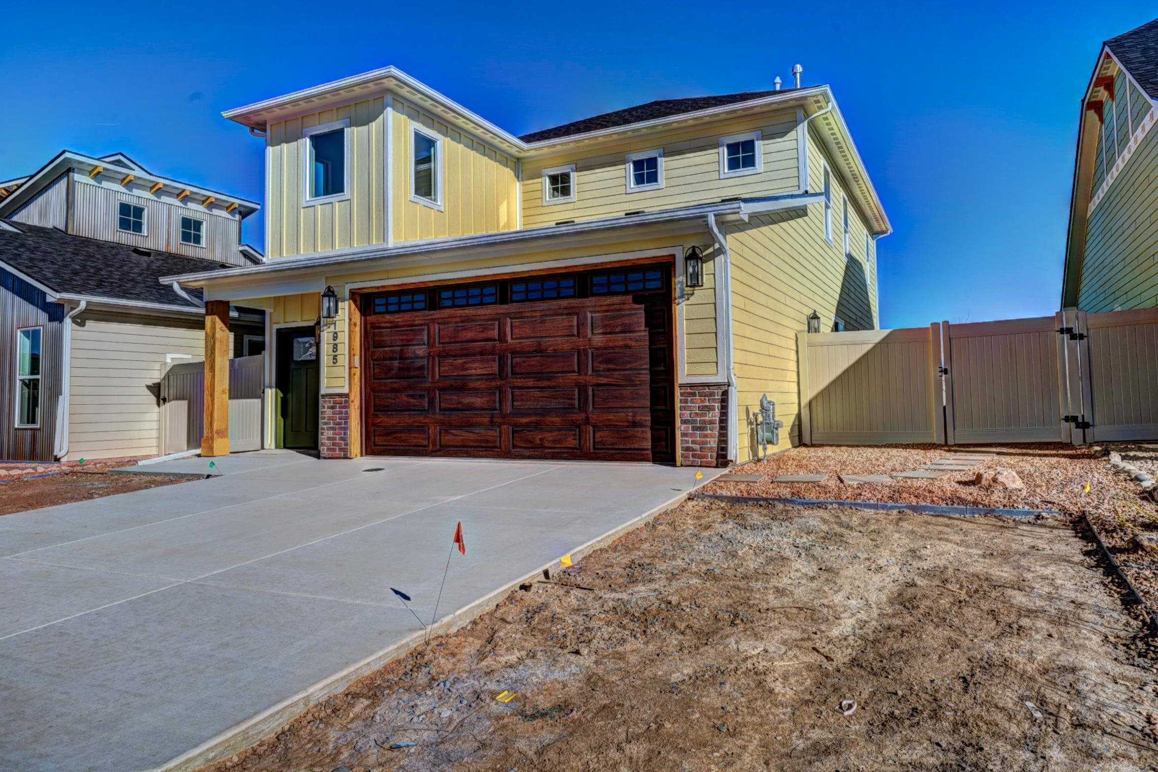 1985 Tomochic Drive Fruita, CO 81521 - Photo 2 of 42 a front view of a house with a garage