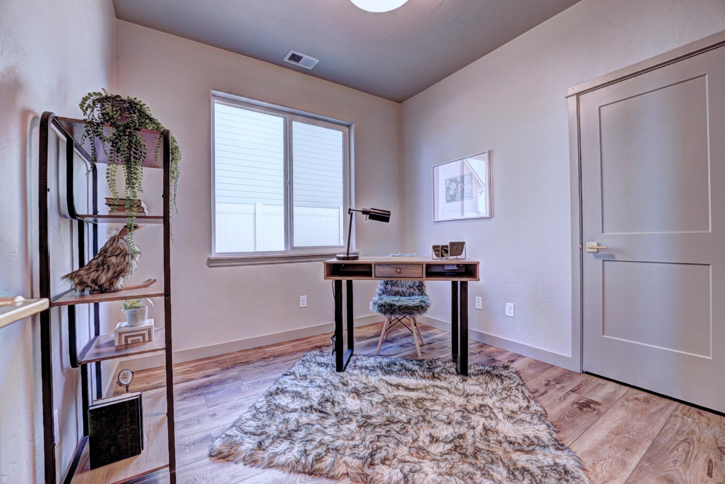 1985 Tomochic Drive Fruita, CO 81521 - Photo 21 of 42 a view of a workspace with furniture and a window