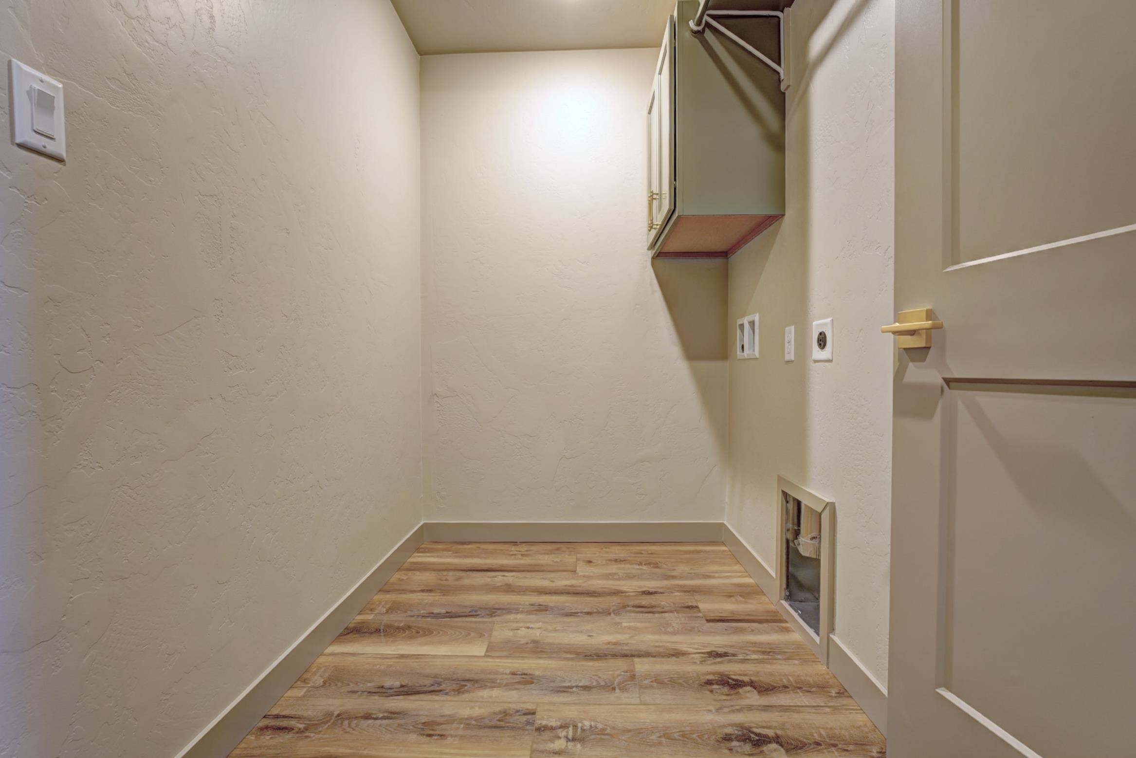 1985 Tomochic Drive Fruita, CO 81521 - Photo 22 of 42 a view of a hallway with wooden floor and entryway