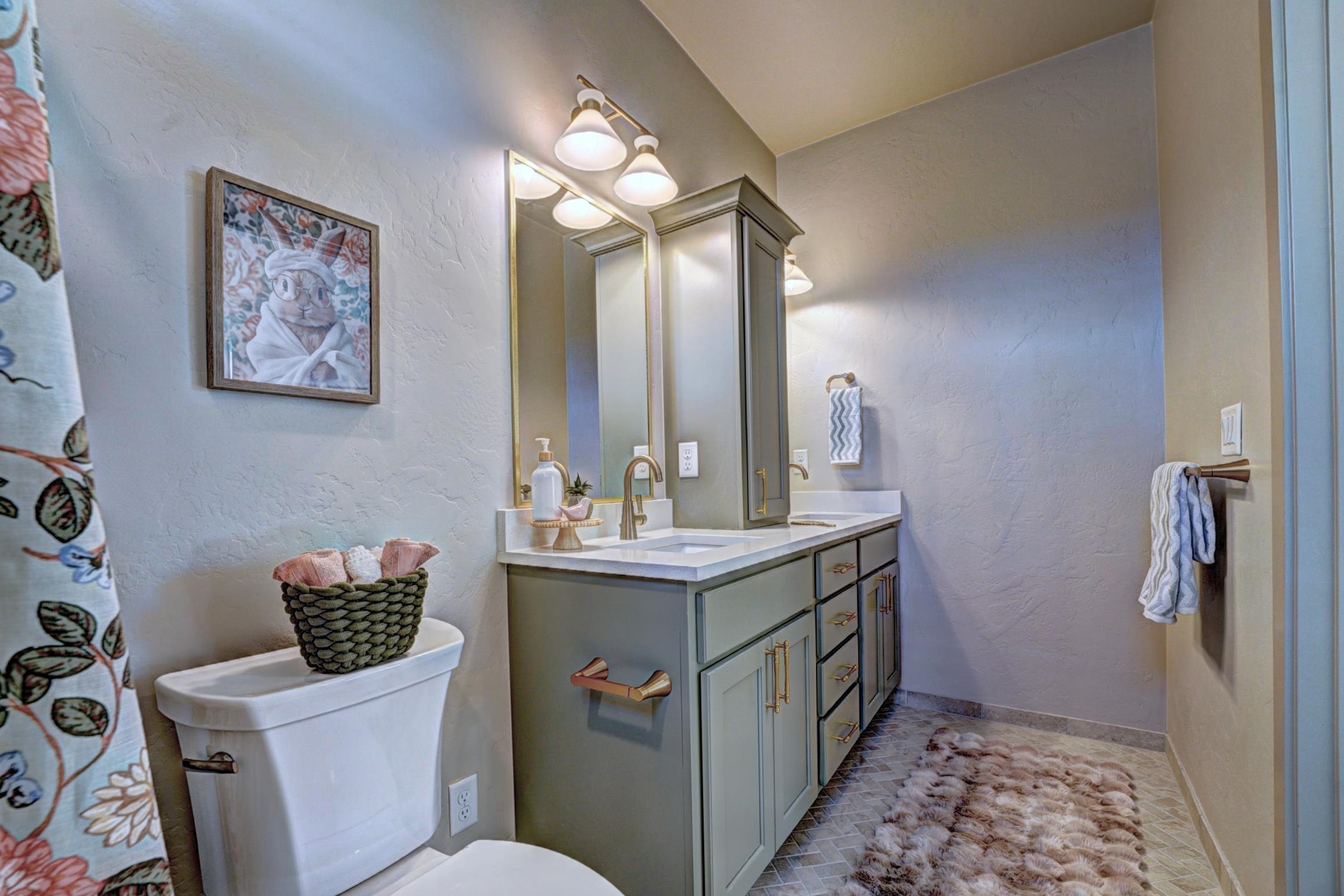 1985 Tomochic Drive Fruita, CO 81521 - Photo 30 of 42 a bathroom with a sink a toilet and mirror