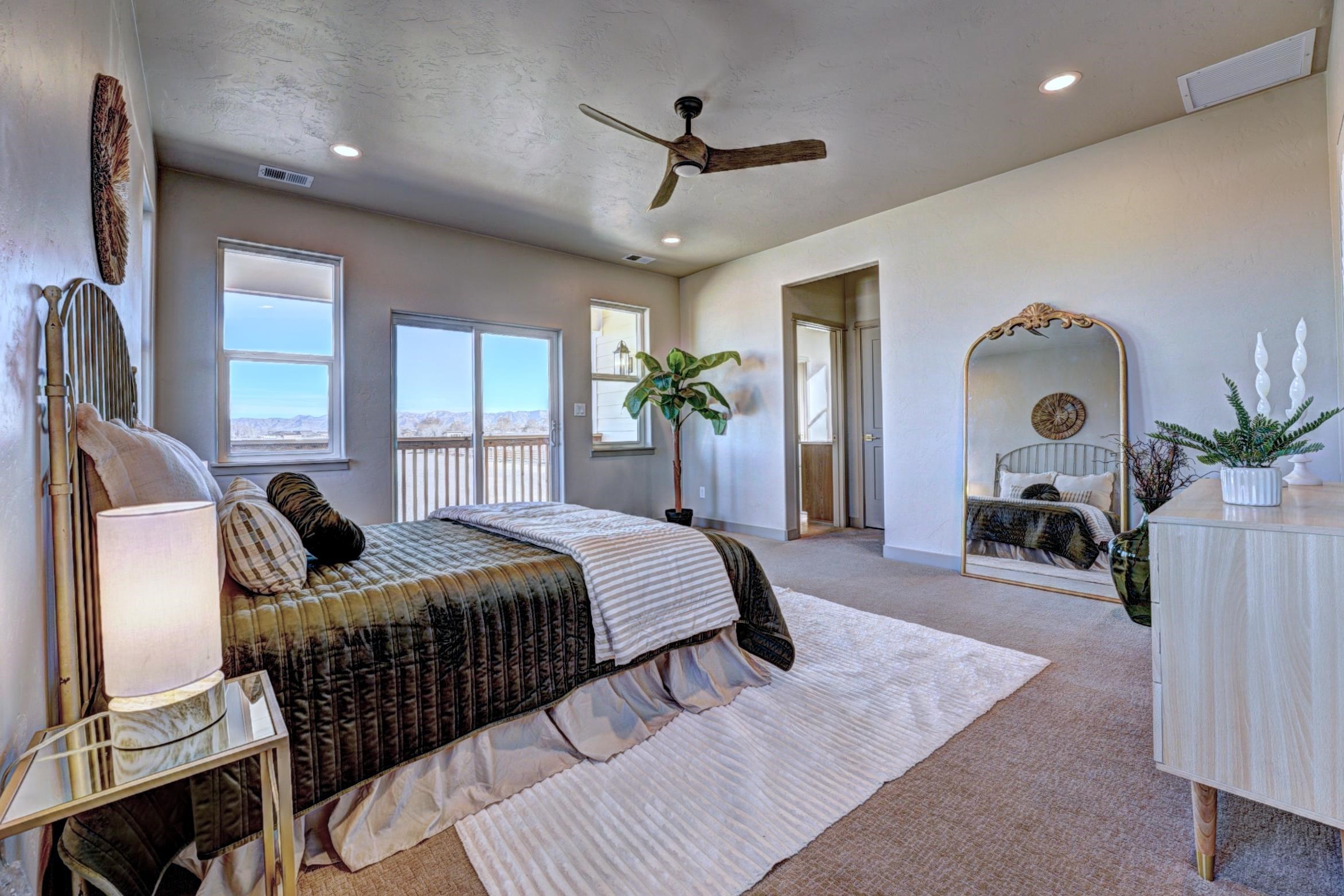 1985 Tomochic Drive Fruita, CO 81521 - Photo 33 of 42 a bed room with furniture and a chandelier