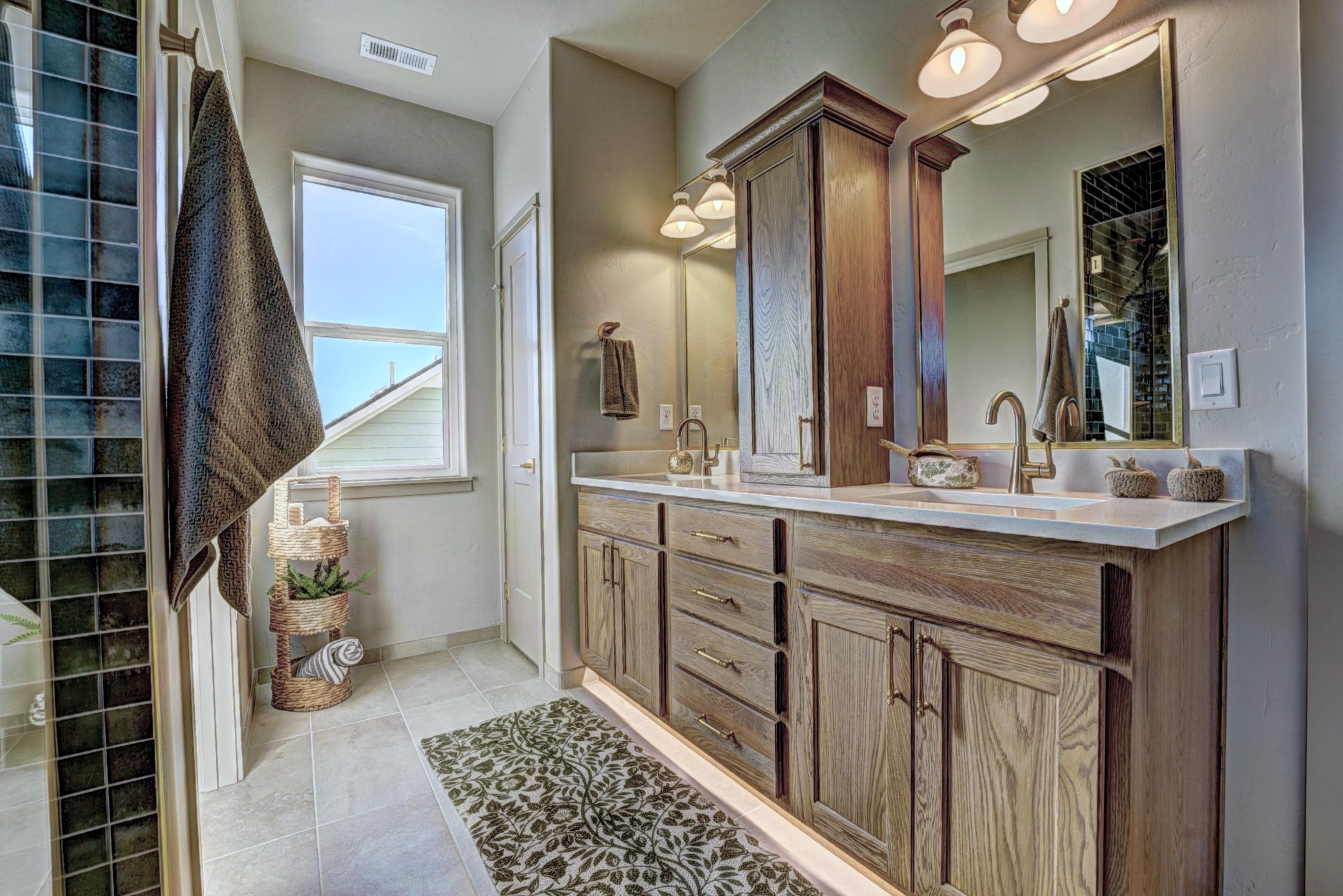 1985 Tomochic Drive Fruita, CO 81521 - Photo 41 of 42 a bathroom with a double vanity sink and a mirror