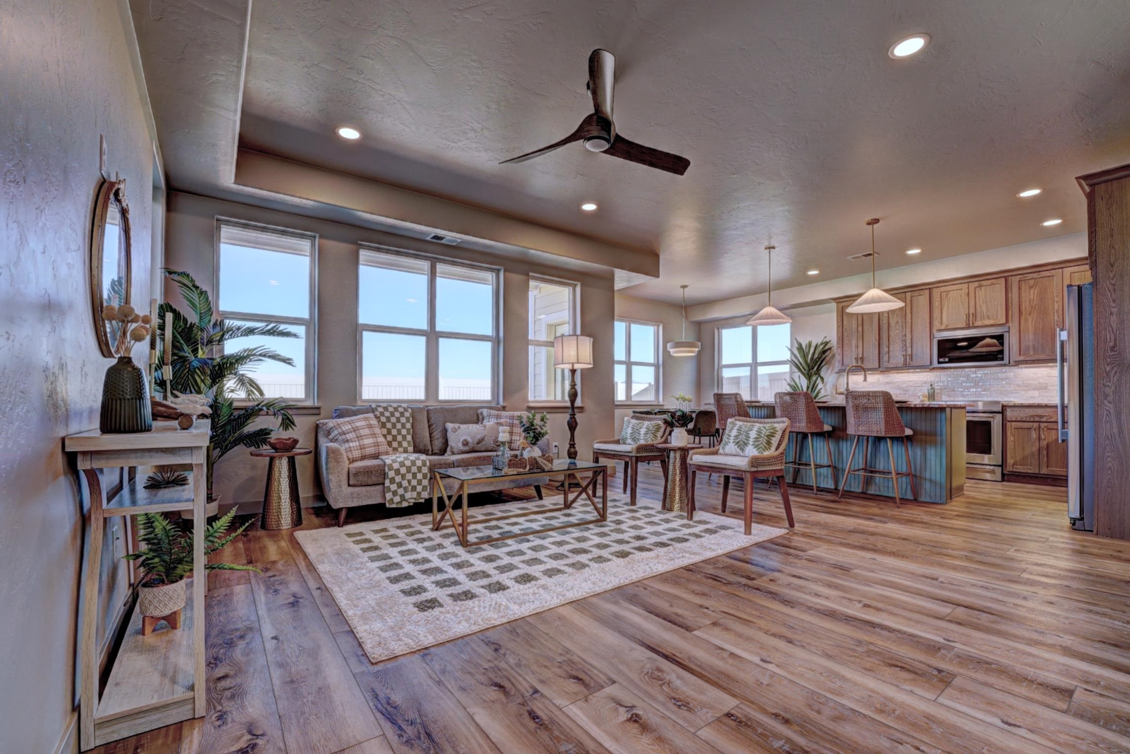 1985 Tomochic Drive Fruita, CO 81521 - Photo 5 of 42 a living room with furniture dining table a large window and potted plants