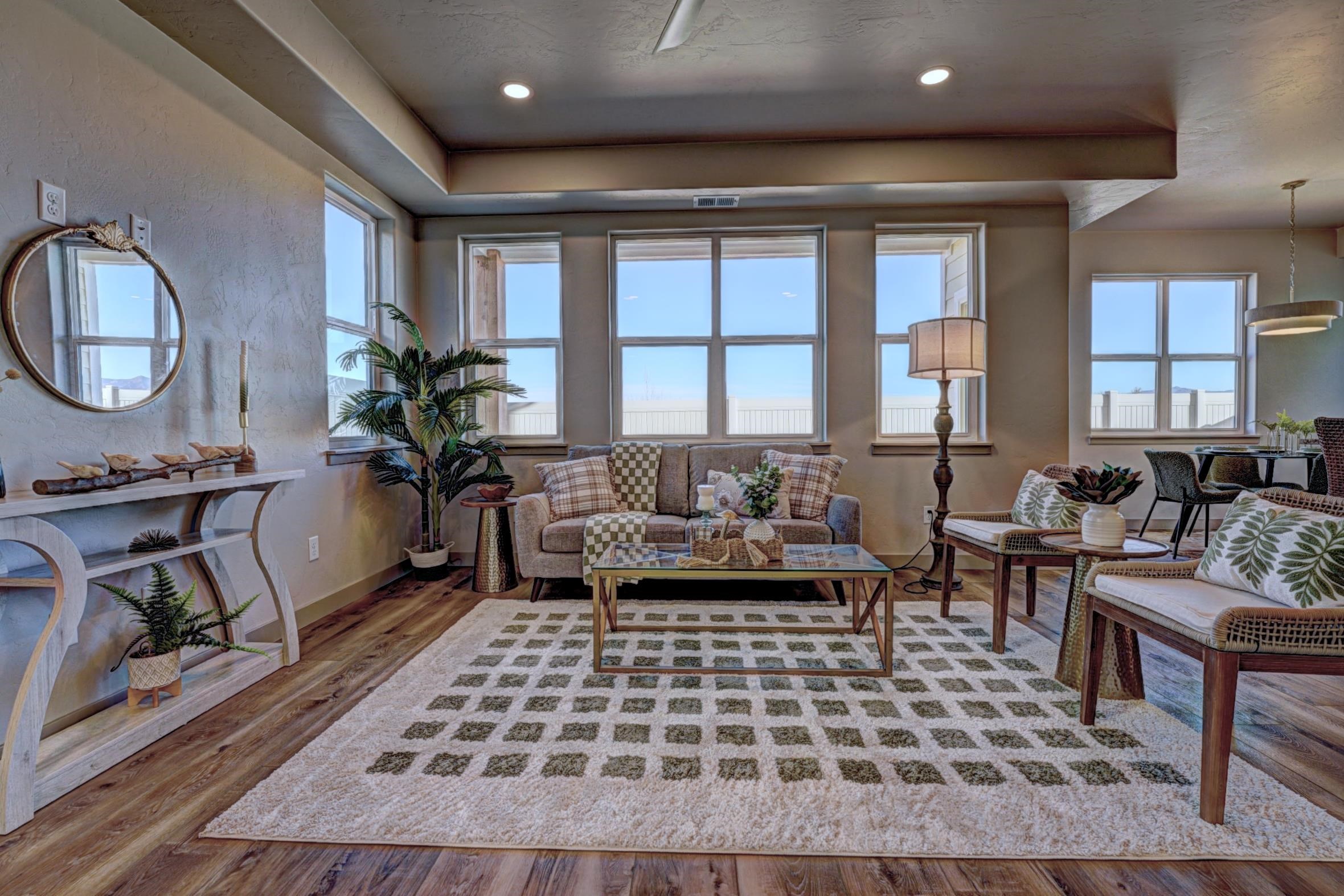 1985 Tomochic Drive Fruita, CO 81521 - Photo 6 of 42 a living room with furniture a rug and a chandelier