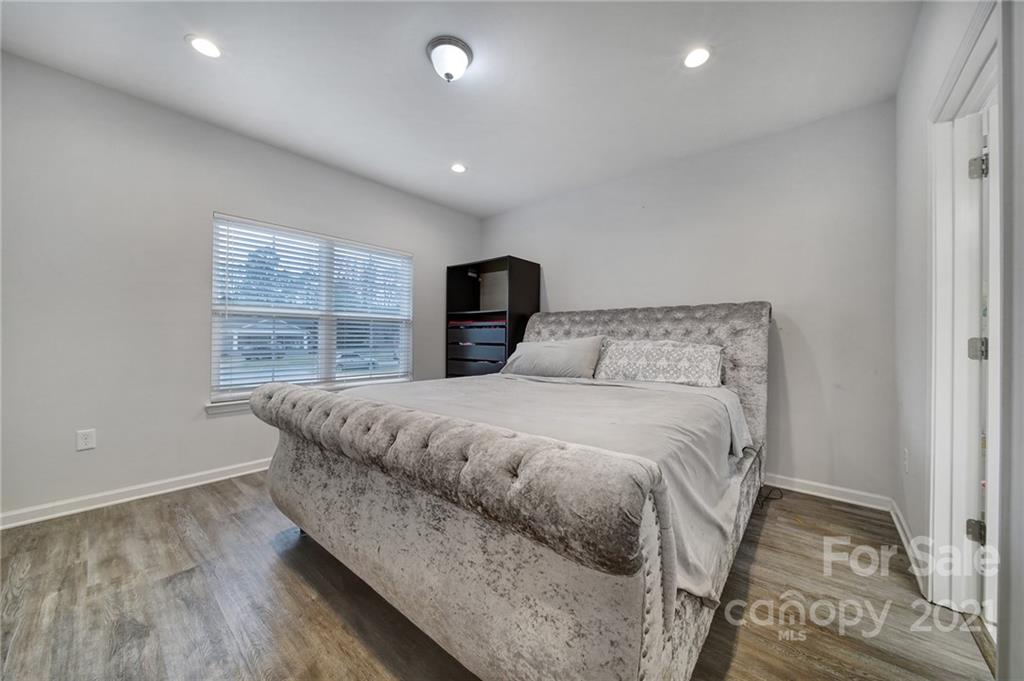 5040 Cheviot Road Charlotte, NC 28269 - Photo 14 of 27 a bedroom with a bed and a window