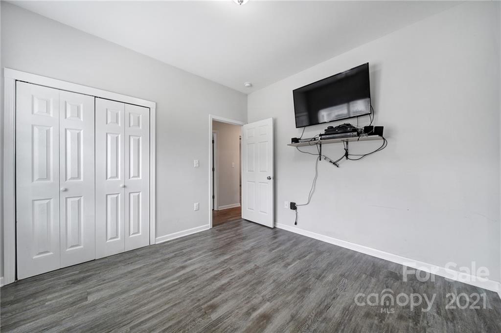 5040 Cheviot Road Charlotte, NC 28269 - Photo 22 of 27 a view of a livingroom with wooden floor