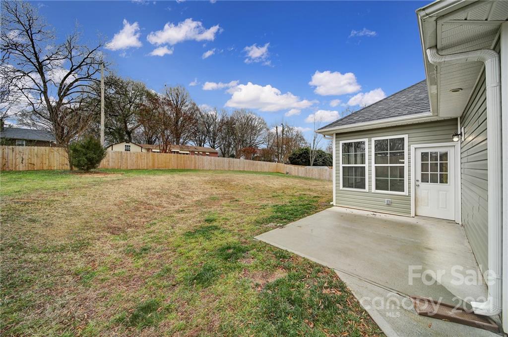 5040 Cheviot Road Charlotte, NC 28269 - Photo 24 of 27 a view of a yard with a house in the background