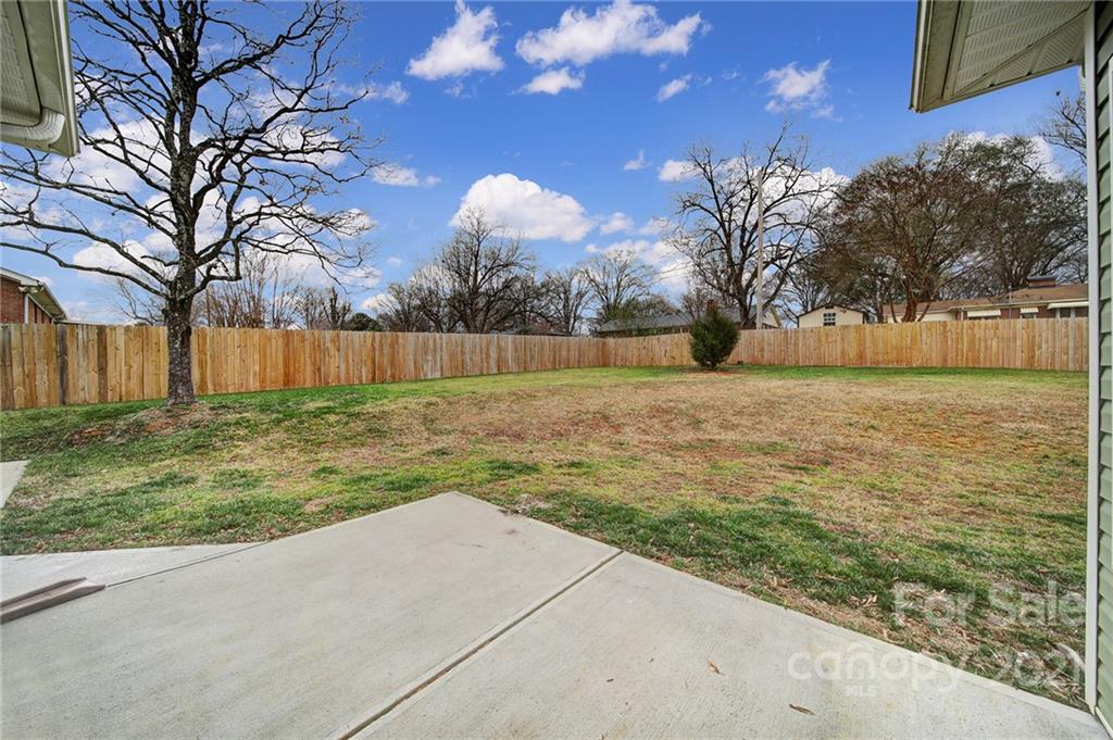 5040 Cheviot Road Charlotte, NC 28269 - Photo 25 of 27 a view of a yard with large trees