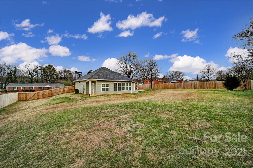 5040 Cheviot Road Charlotte, NC 28269 - Photo 27 of 27 a view of a house with a yard