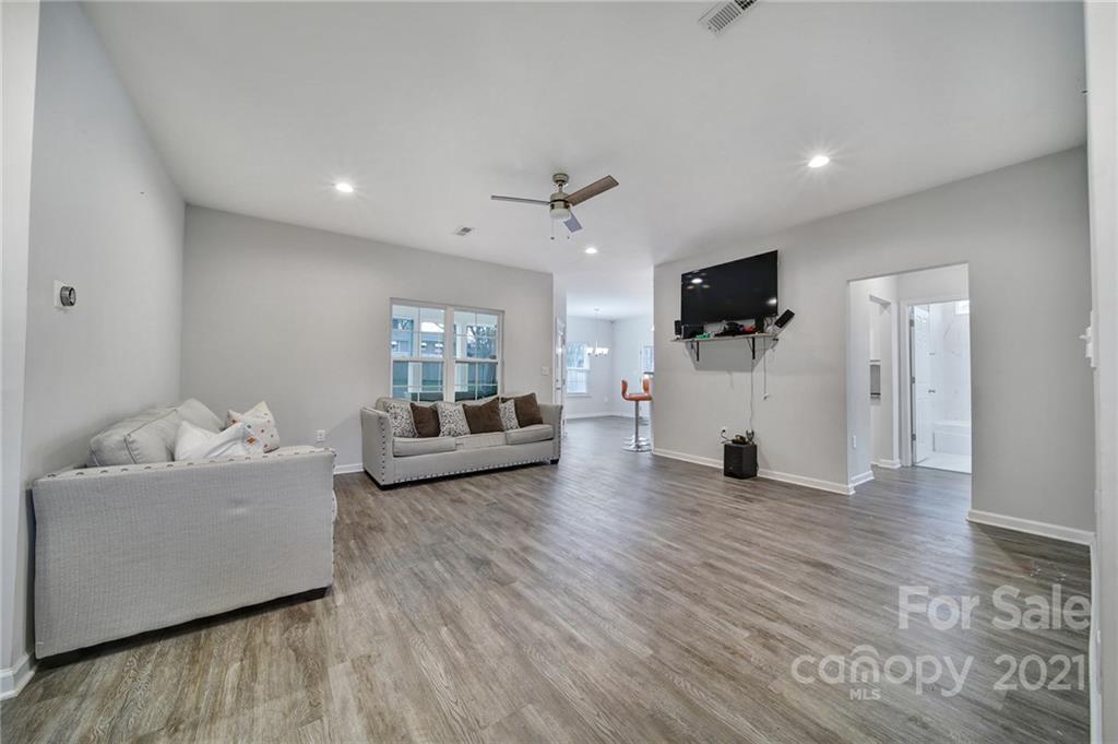 5040 Cheviot Road Charlotte, NC 28269 - Photo 9 of 27 a living room with furniture and a flat screen tv