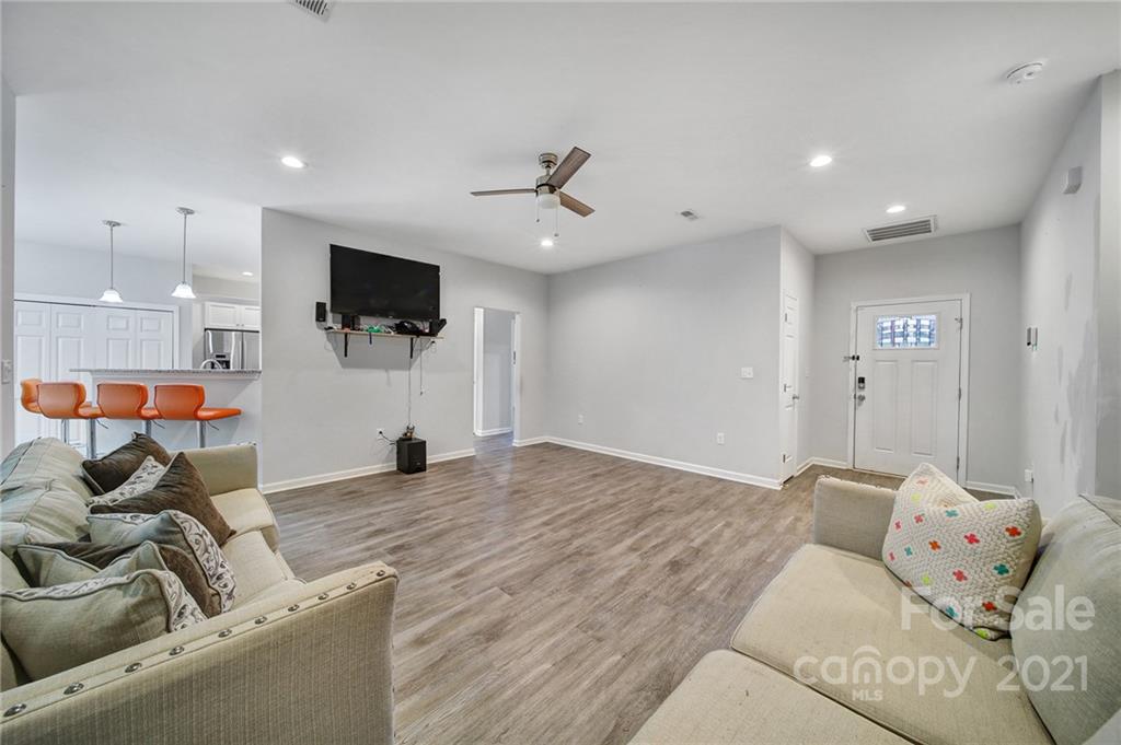 5040 Cheviot Road Charlotte, NC 28269 - Photo 10 of 27 a living room with furniture and a flat screen tv