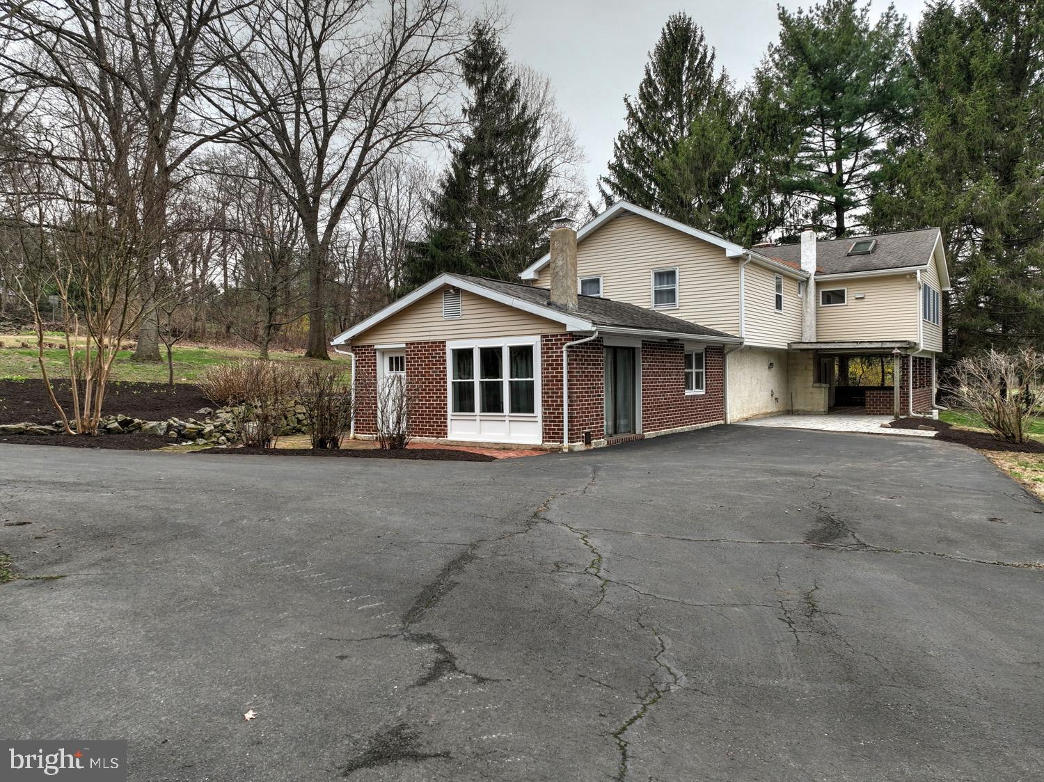 1822 Little Conestoga Road Elverson, PA 19520 - Photo 13 of 30 a view of a house with a large tree and a yard