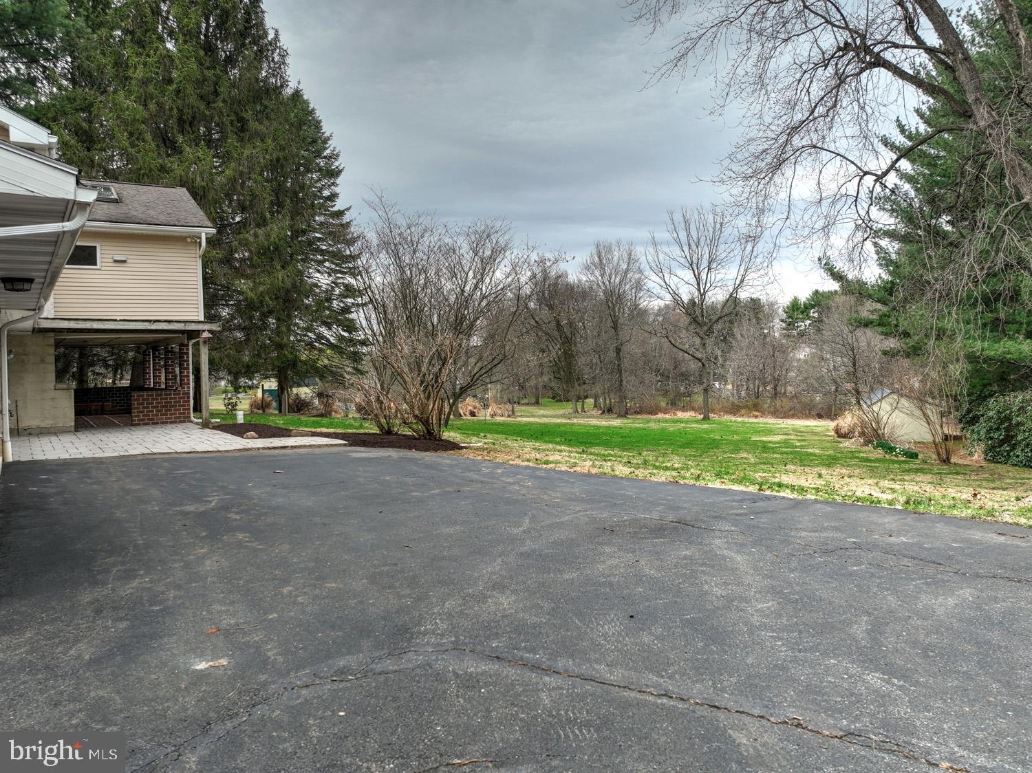 1822 Little Conestoga Road Elverson, PA 19520 - Photo 15 of 30 a view of a house with a yard and garage