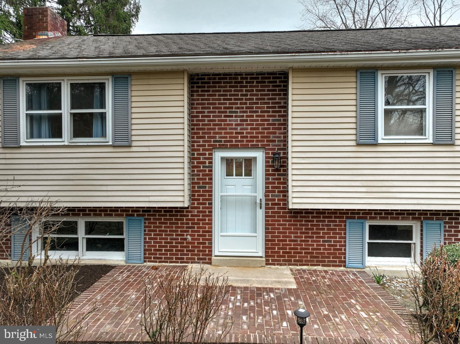 1822 Little Conestoga Road Elverson, PA 19520 - Photo 3 of 30 a front view of a house with large windows