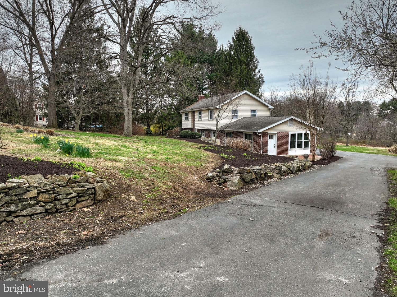 1822 Little Conestoga Road Elverson, PA 19520 - Photo 6 of 30 a front view of a house with a yard and trees